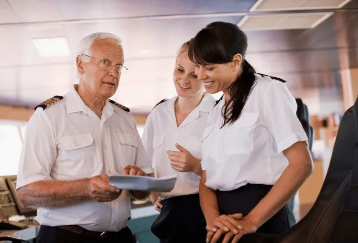 Boat captain talking with two assistants