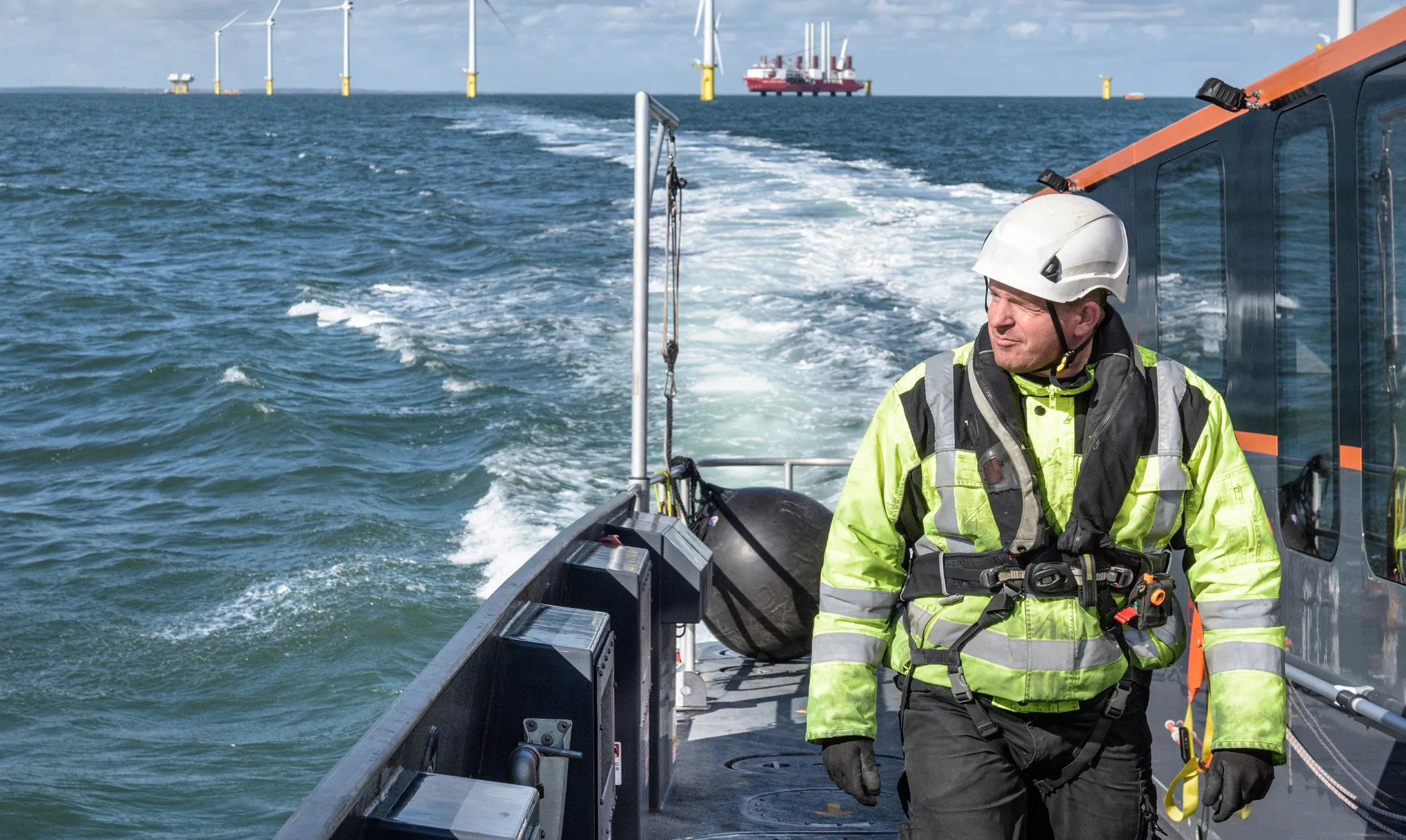 Person in safety gear on a large vessel