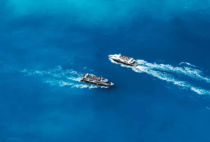 Two tour boats passing one another