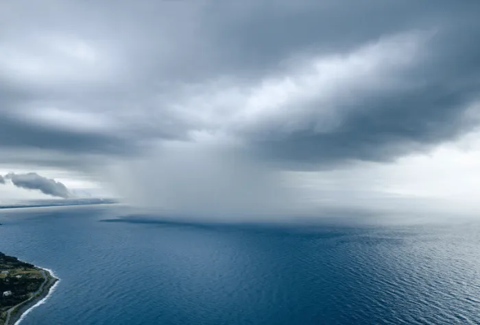 A patch of rain over ocean and off the coast
