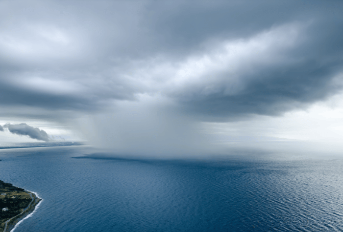 A patch of rain over ocean and off the coast