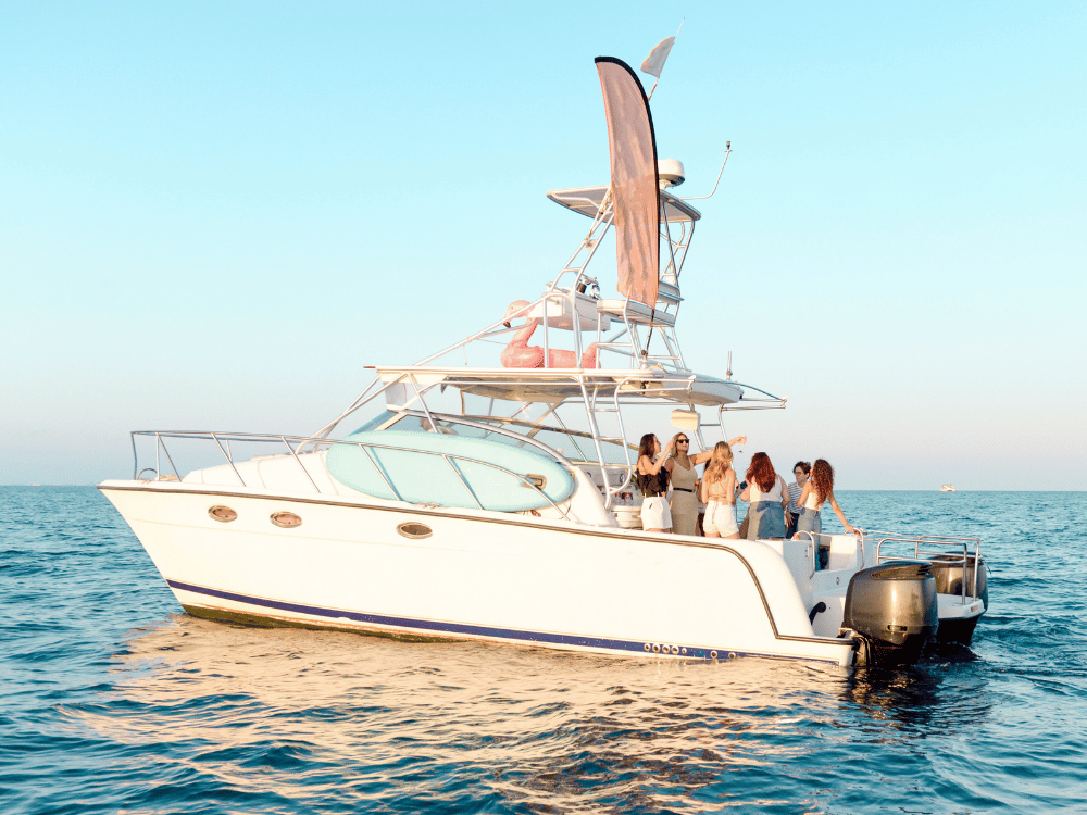 Group of people partying on charter boat in the ocean