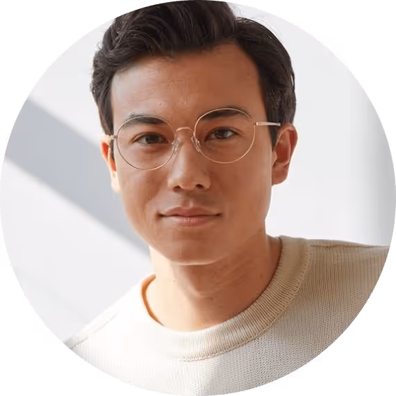 A man wearing glasses looking at the camera.