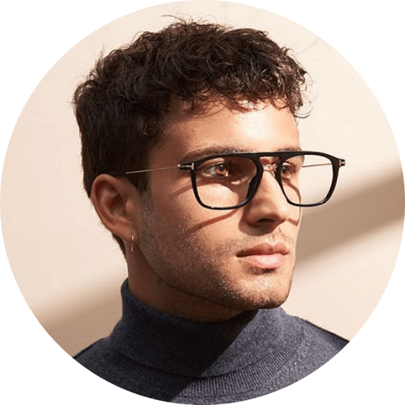 A man wearing glasses and a turtle neck sweater.