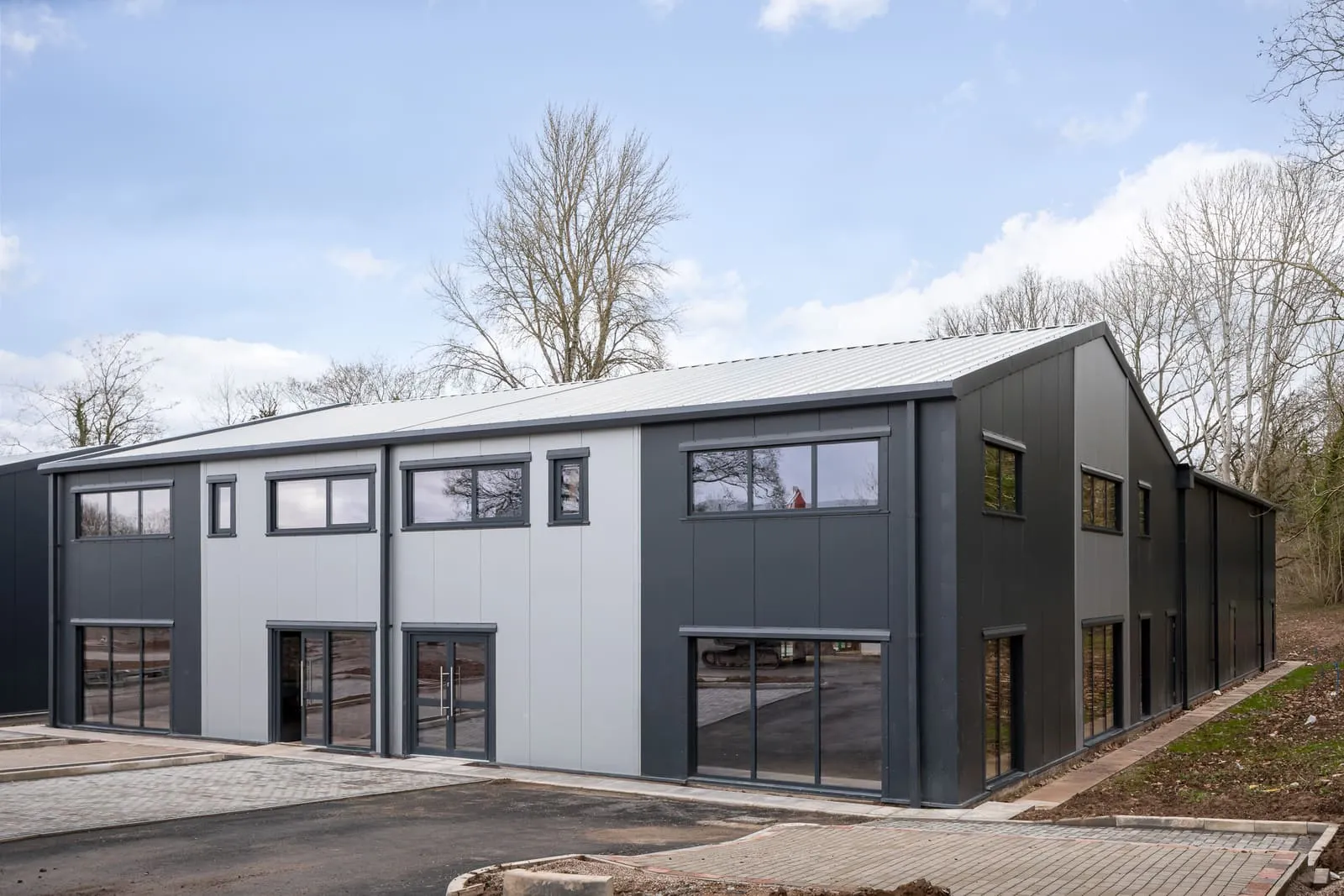 Insulated wall cladding panels fitted to a steel building frame