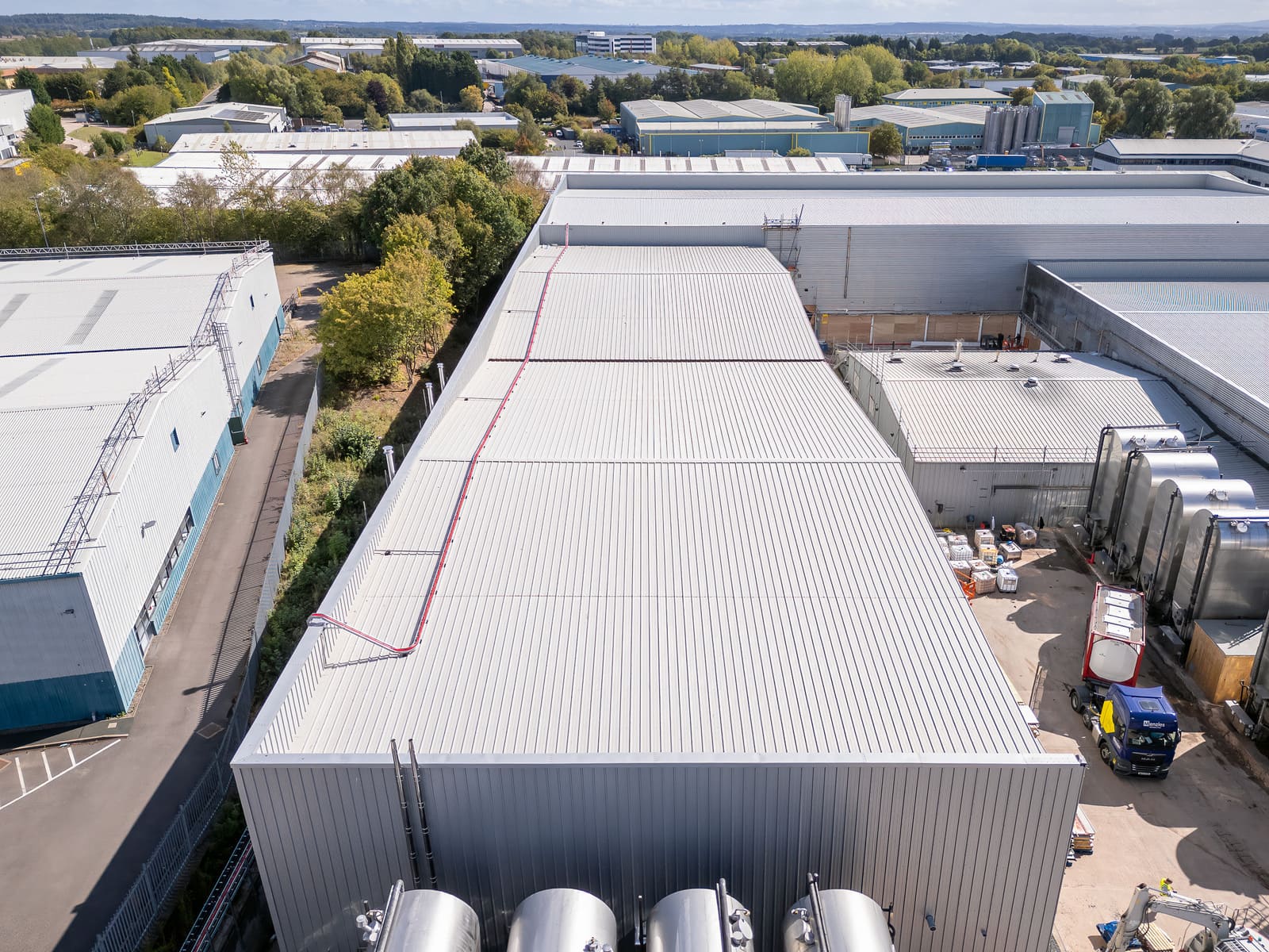 Insulated roof cladding installation on a steel-framed building