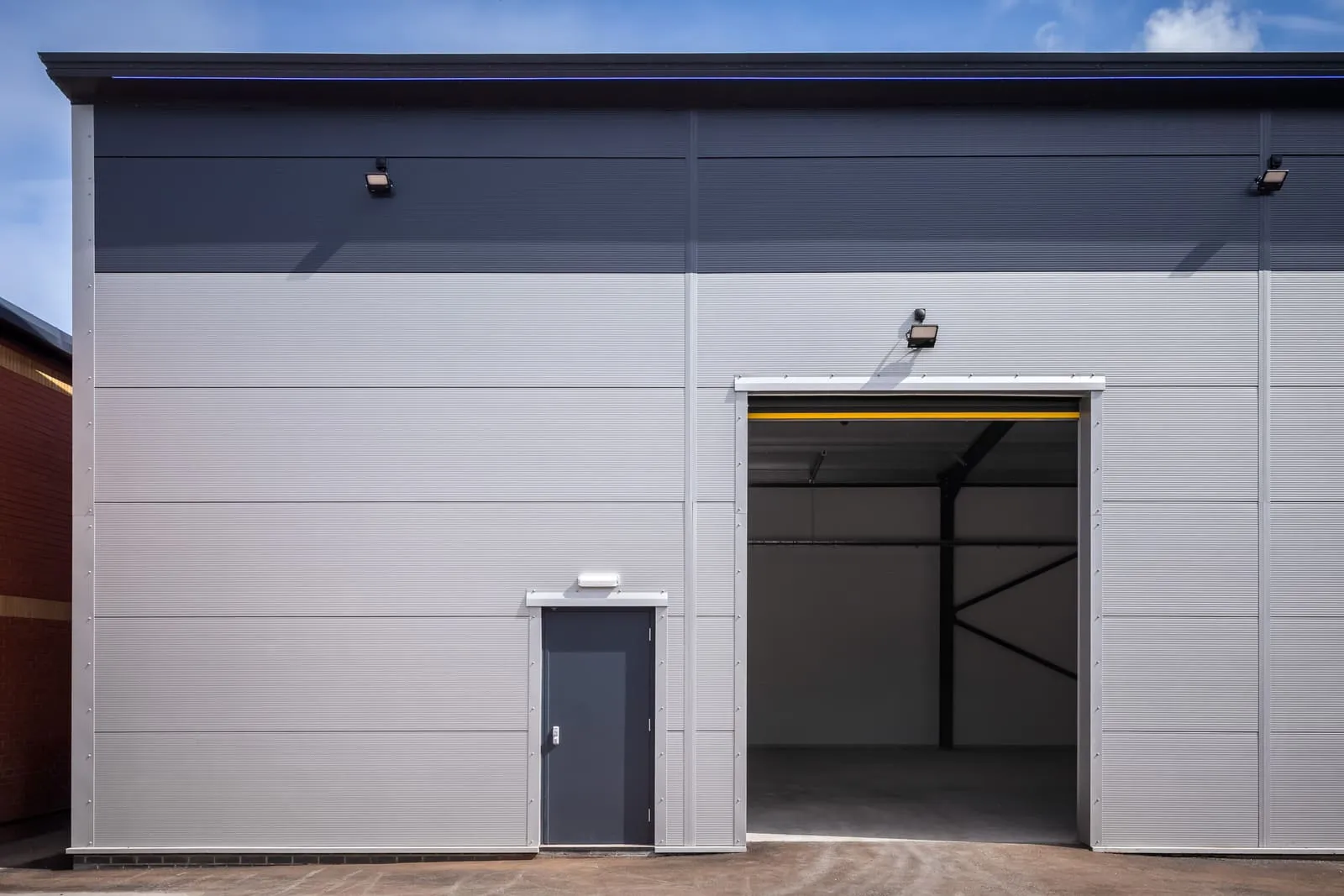 Roller shutter industrial door on a steel-framed commercial building