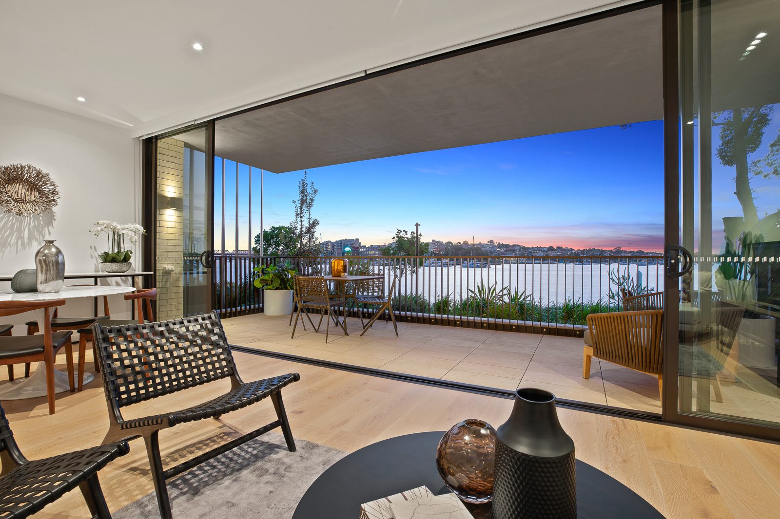 Twilight photo of a balcony at dusk, real estate photography by UberRE