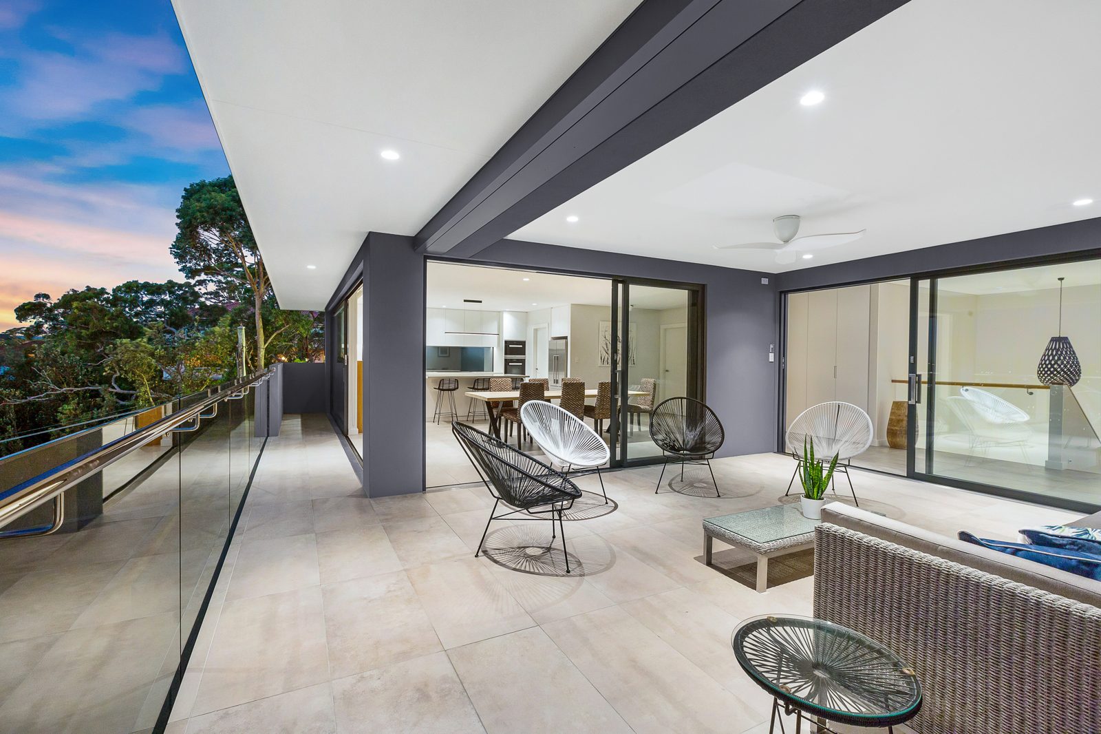 Twilight photo of an outdoor terrace, real estate photography by UberRE