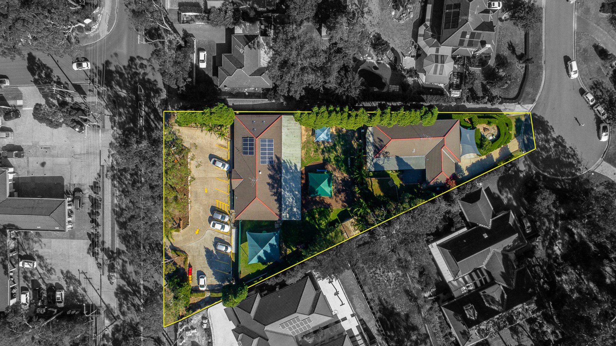 Top-down drone photo with the property boundary marked by UberRE