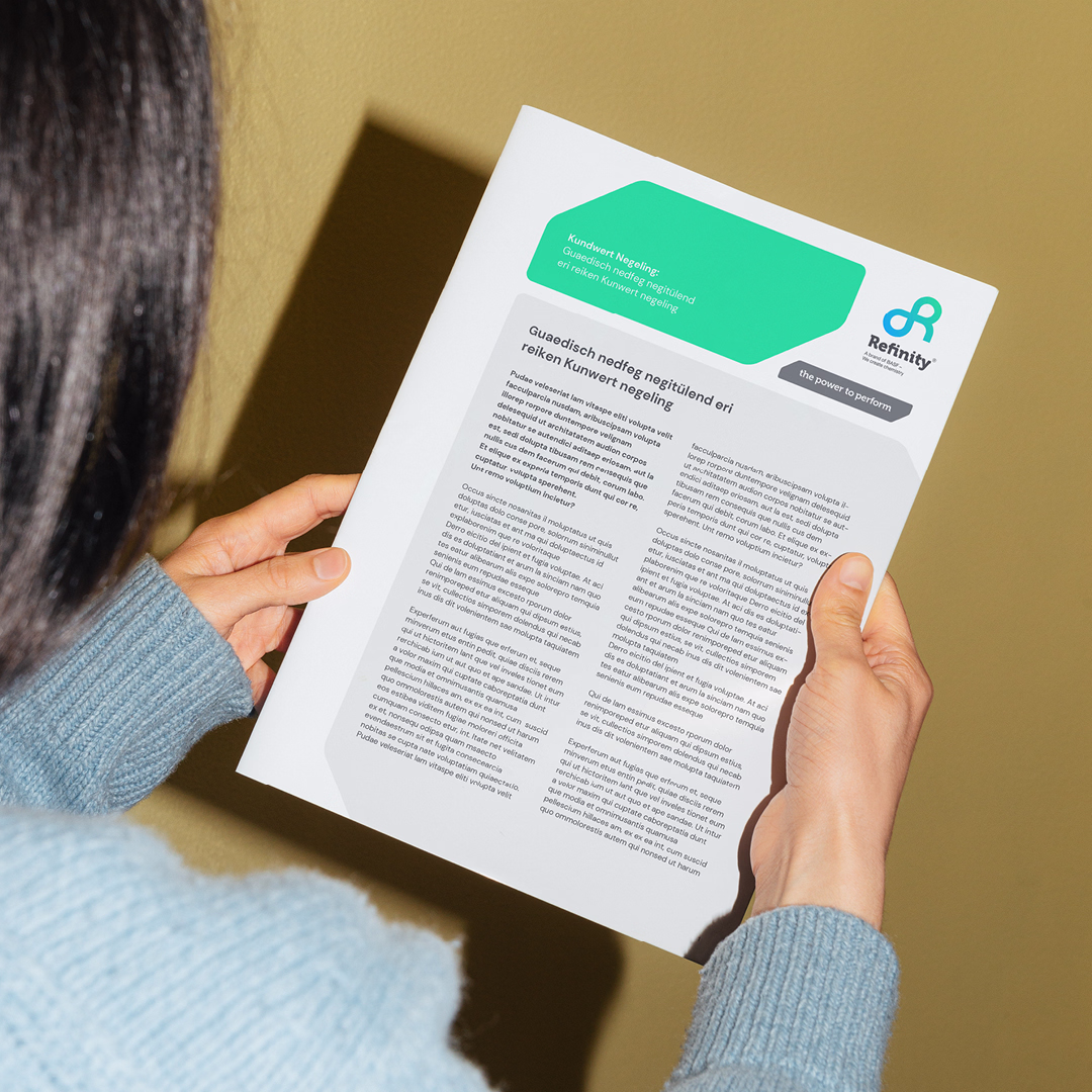 A Refinity text document being held by a woman