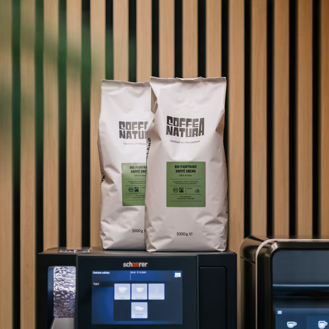 A white and green bag of "Coffea Natura".