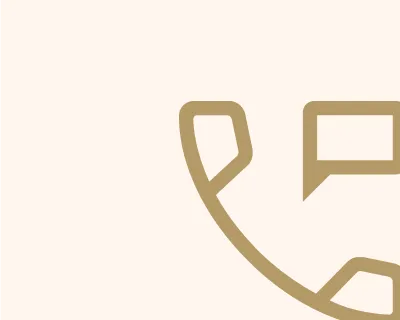 Minimalist gold phone handset icon with a speech bubble on a light beige background.