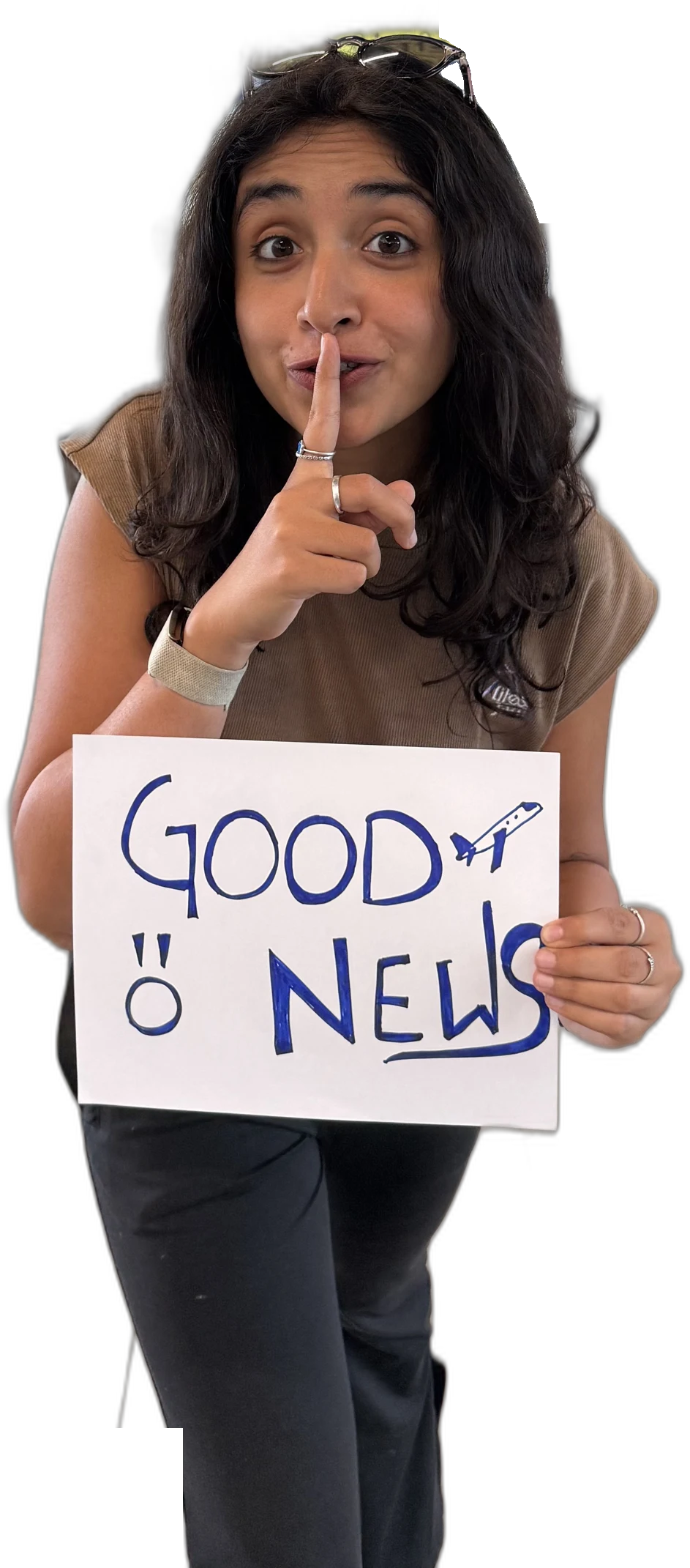 Aakanksha holding a Good News sign