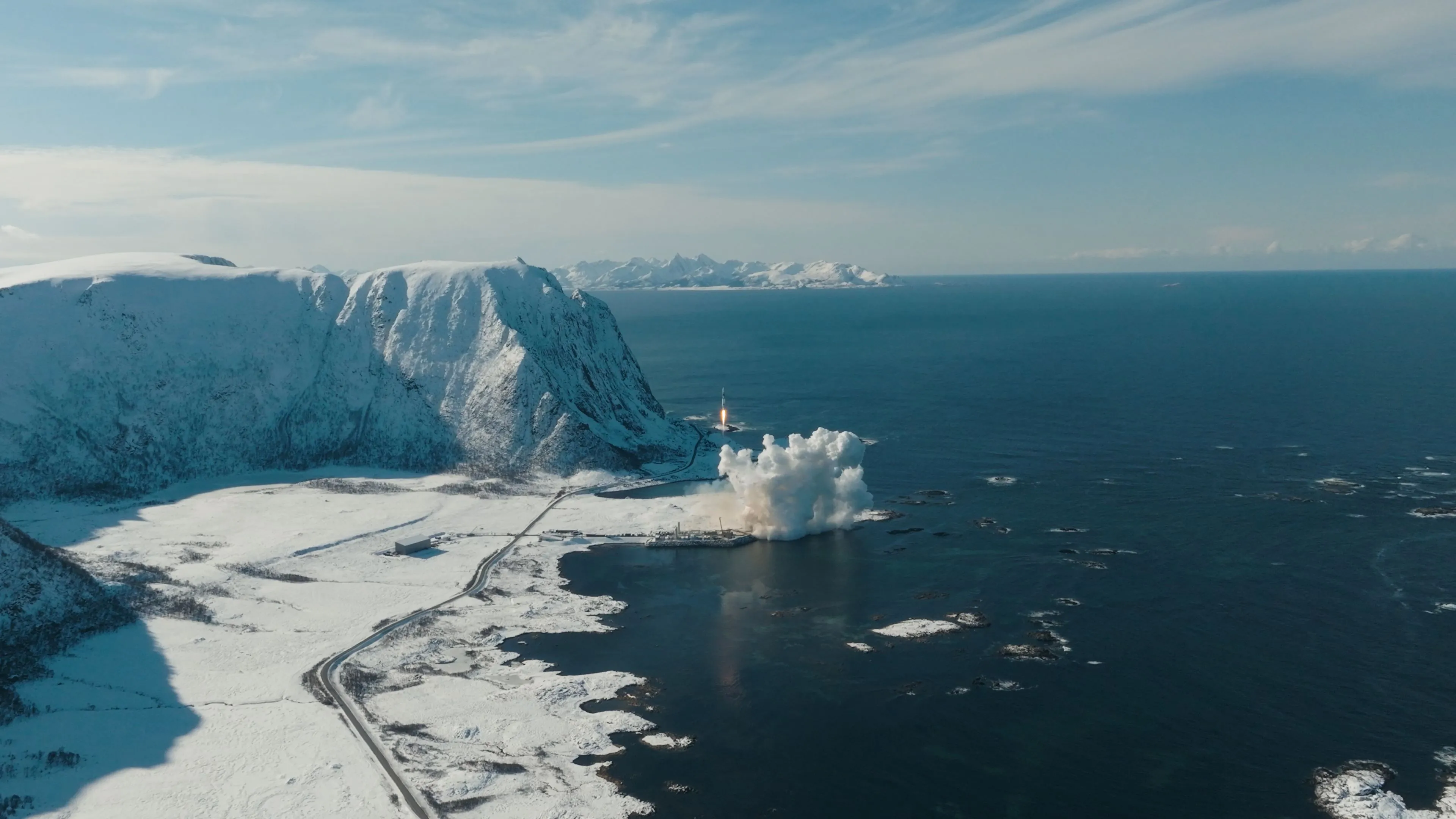 Iced Norway landscape with a rocket launch