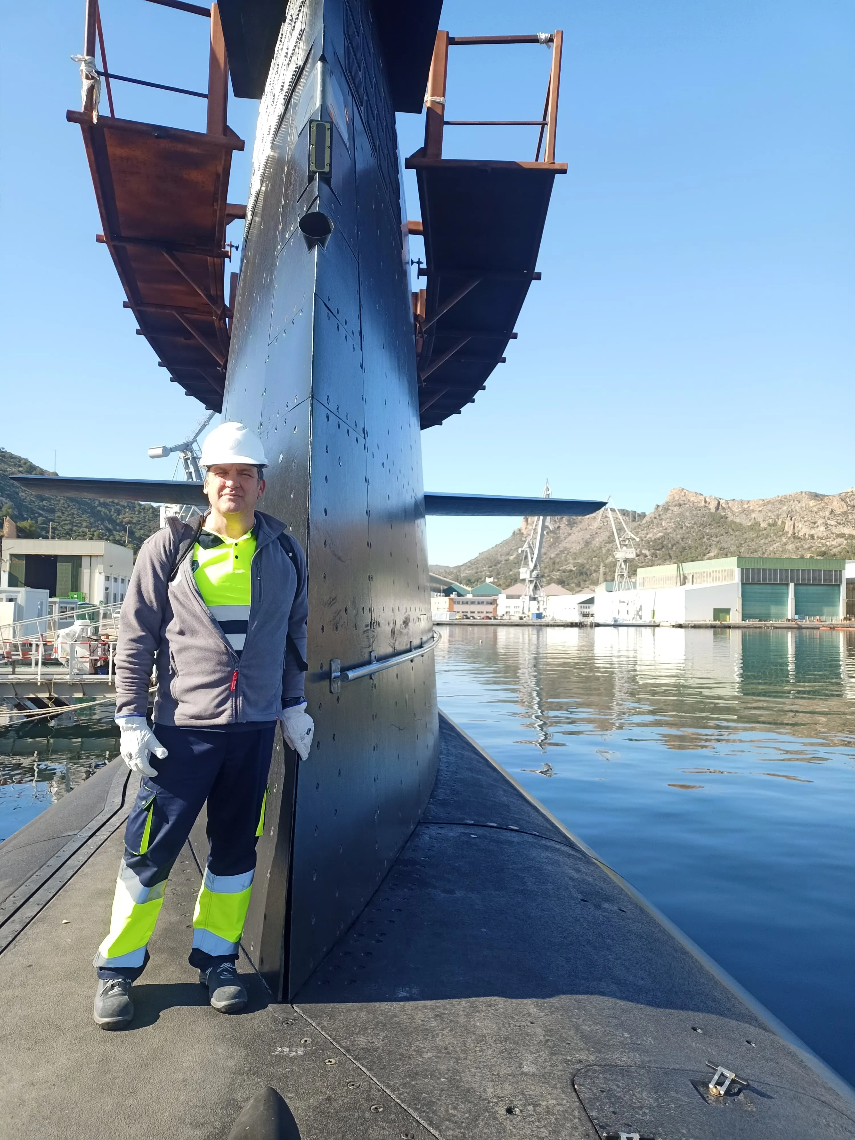 Worker standing in a submarine
