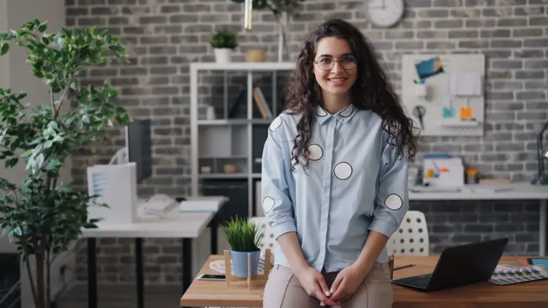 Portfolio manager standing at a desk in an office