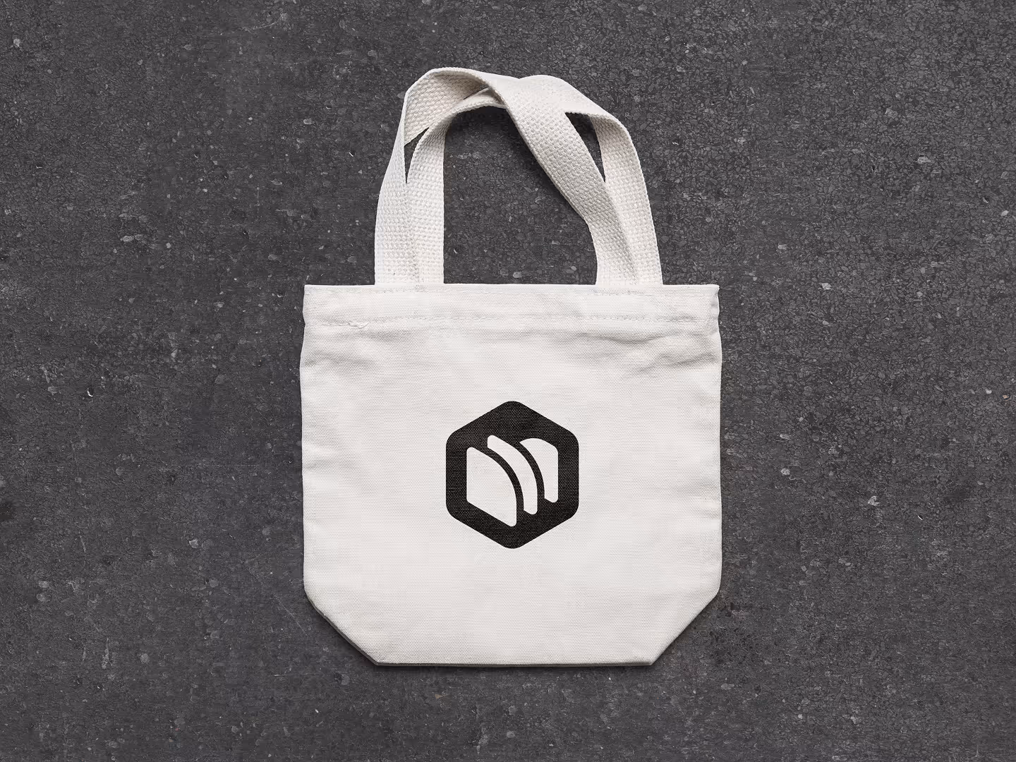 Tech startup company branded tote bag mockup featuring tech startup logo.