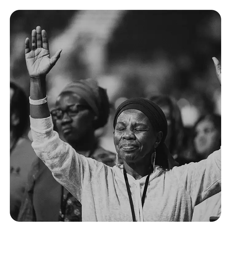 Awake America - woman in worship and prayer during Christian revival meeting