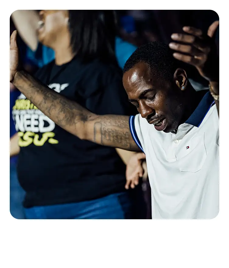 Awake America - man in prayer and worship at Awake America spiritual awakening event