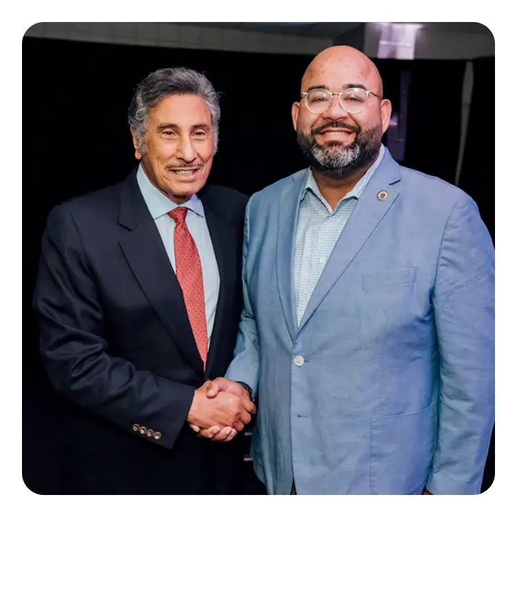 Awake America - two men shaking hands at national prayer movement event