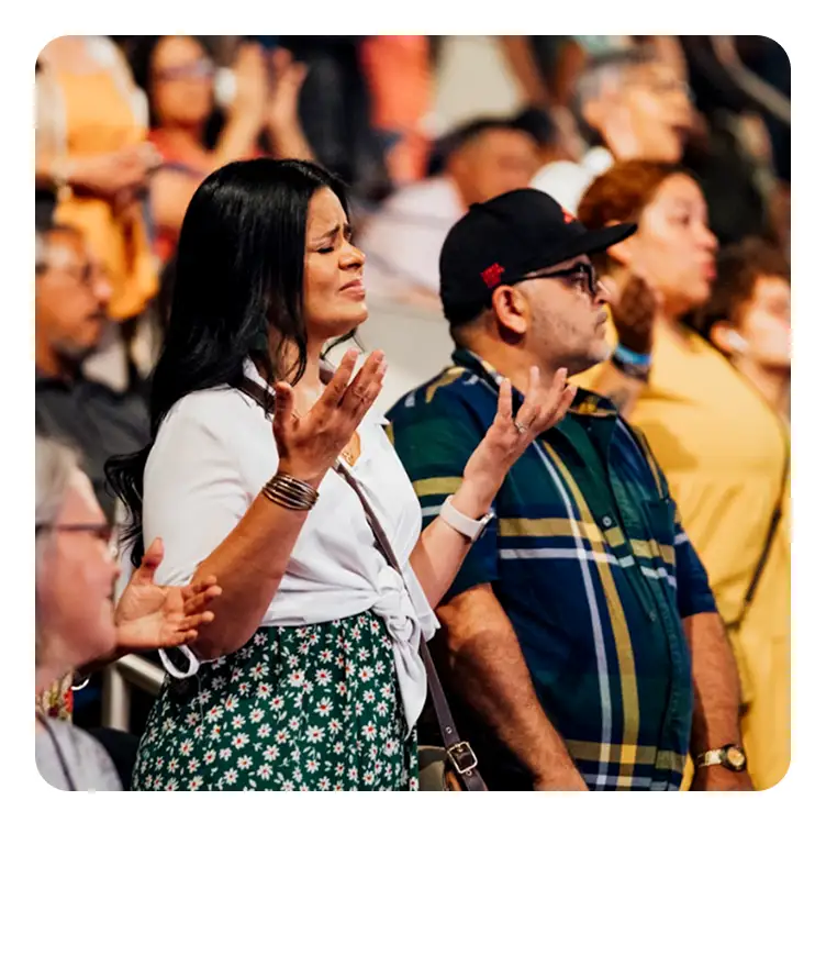 Awake America - woman in worship and prayer during Christian revival meeting