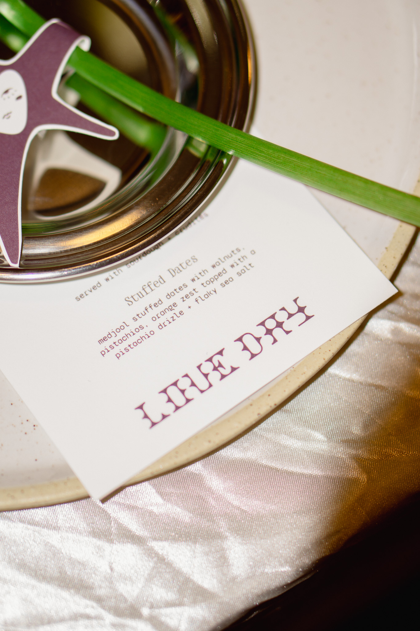 Every so often at ENC, we give ourselves a brief that doesn’t belong to a client, just the ENC ladies in a room asking one simple question: what do we want to make right now? These projects live inside what we call ENC Labs, a space where we get to follow instinct, test ideas, and create something purely because it feels right. This time, the conversation landed on Valentine’s Day. And if we’re being honest, it felt a little, okay a lot… tired. A holiday that once celebrated connection now mostly shows up as chocolate boxes, crowded restaurants, and a whole lot of pressure for one night that’s supposed to represent love. Love, at least the kind we believe in, has never lived inside a single calendar square. Around here, love is a practice. It’s the quiet ways we show up for one another day after day. The text you send because someone crossed your mind. The boundary you set to protect your peace. The collaboration that sparks something bigger than either person could have made alone. The messy, evolving, human version of love that doesn’t need a spotlight to matter. So we scrapped Valentine’s Day and made Love Day instead. And more importantly, we decided it couldn’t just exist as a graphic or a campaign. If we were going to talk about love, it had to be something you could actually feel in the real world. We started with a meal, because food has always been one of the oldest and simplest love languages. A moment to sit across from one another and remember that connection usually starts around a table. From there, we went analog. We designed a series of Love Notes, printed them as physical cards, sat down together, and wrote each of them by hand. Each note was paired with a fresh flower and addressed to various small businesses across Phoenix that we admire. Then we spent the day driving across the valley delivering them in person. No automation. No templated emails. Just ink, paper, and appreciation. Phoenix is full of remarkable small businesses, and Love Day became our way of saying thank you. A reminder that the most meaningful gestures are often the simplest ones: showing up, offering kindness, and acknowledging the people around you who are doing good work. In the end, Love Day became something bigger than the idea that sparked it. It was a true reflection of what ENC actually believes: that creativity should be human, community should be tangible, and love—real love—is built through small acts of care practiced consistently over time. 