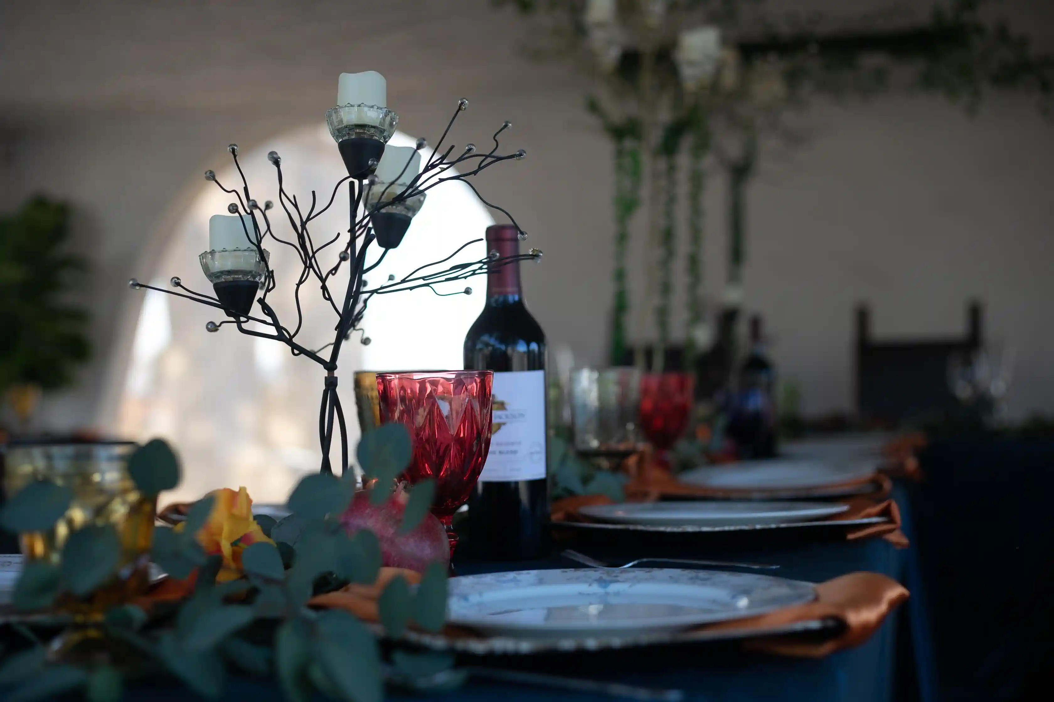 table vignette w wine bottle and glass A