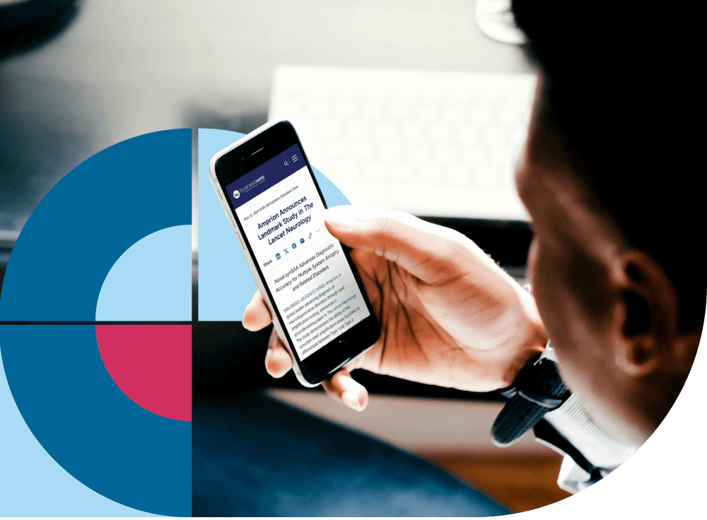 Individual reading timely news about Amprion Diagnostics on their mobile device