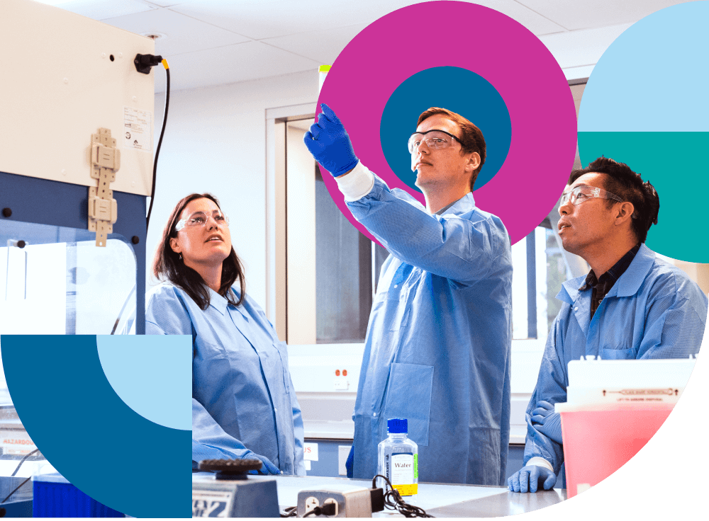 Three diagnostics specialists working together in a clinical laboratory