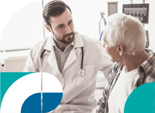 Clinician discussion neurodegenerative diseases with his patient in a medical setting.