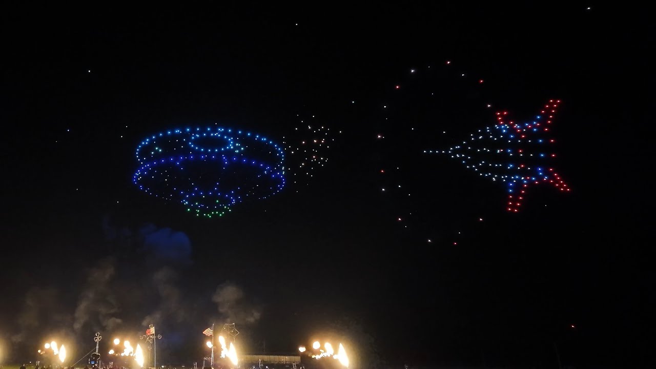 Drone light show forming a complex pattern in the night sky, ideal for large-scale events.