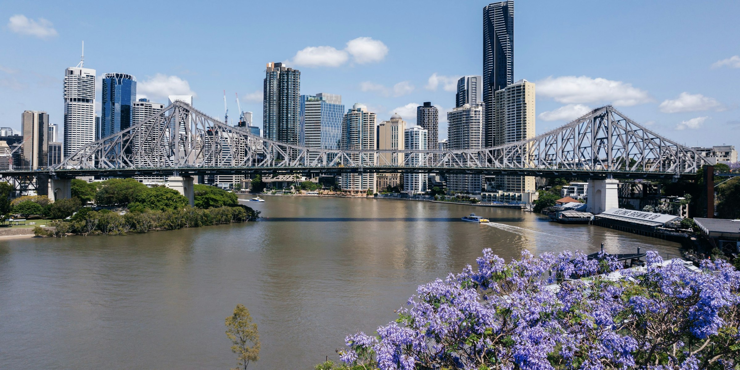 Story Bridge and the Brisbane skyline across the river on a sunny day