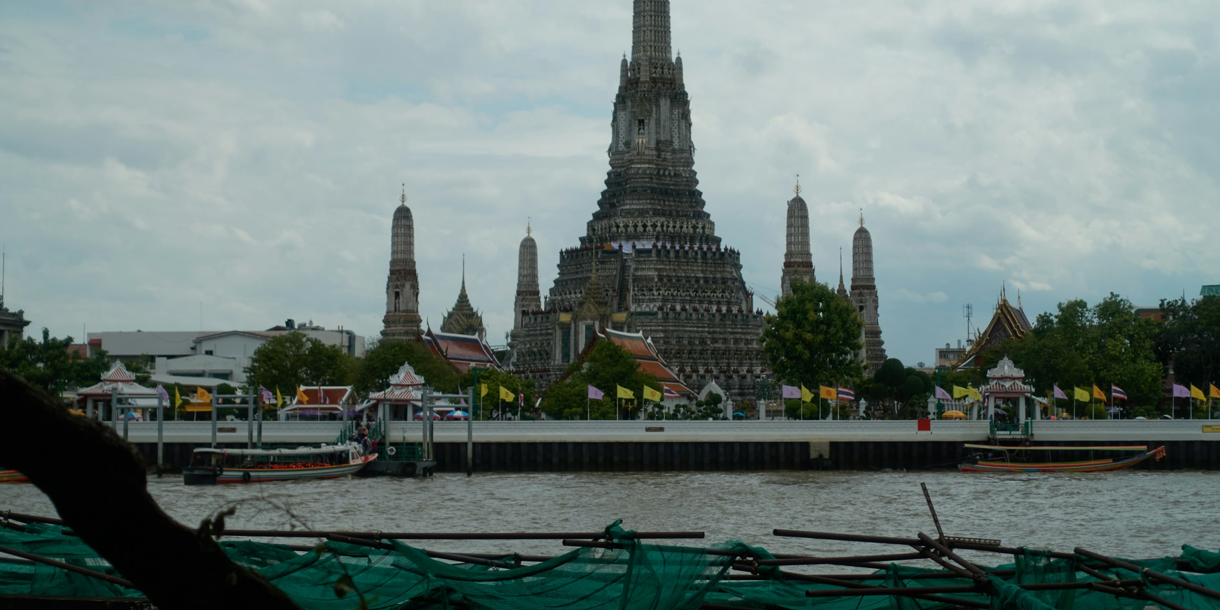 Wat Arun temple beside the Chao Phraya River in Bangkok