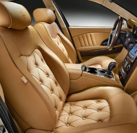 Tan leather interior seats inside a luxury car