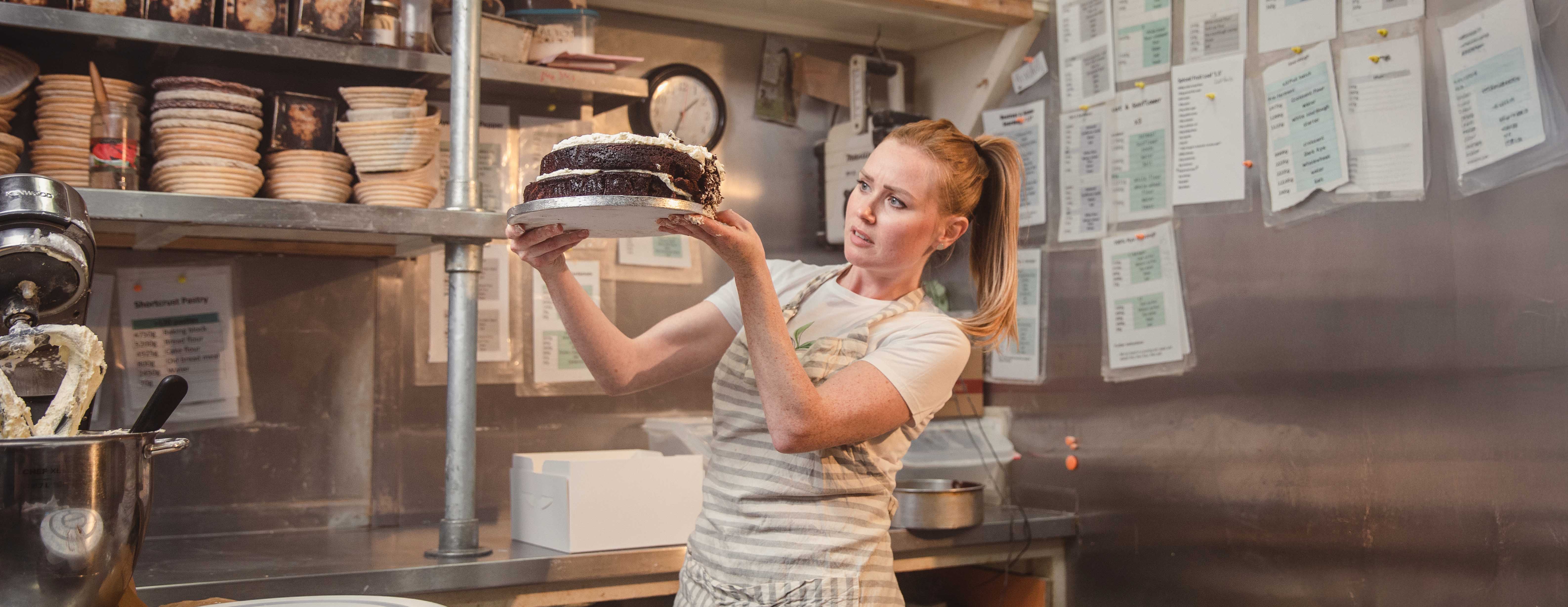 Baker shown at work as part of cinematic advert for online accounting firm Debitam. 
