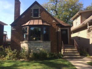 Brick home with bay windows 
