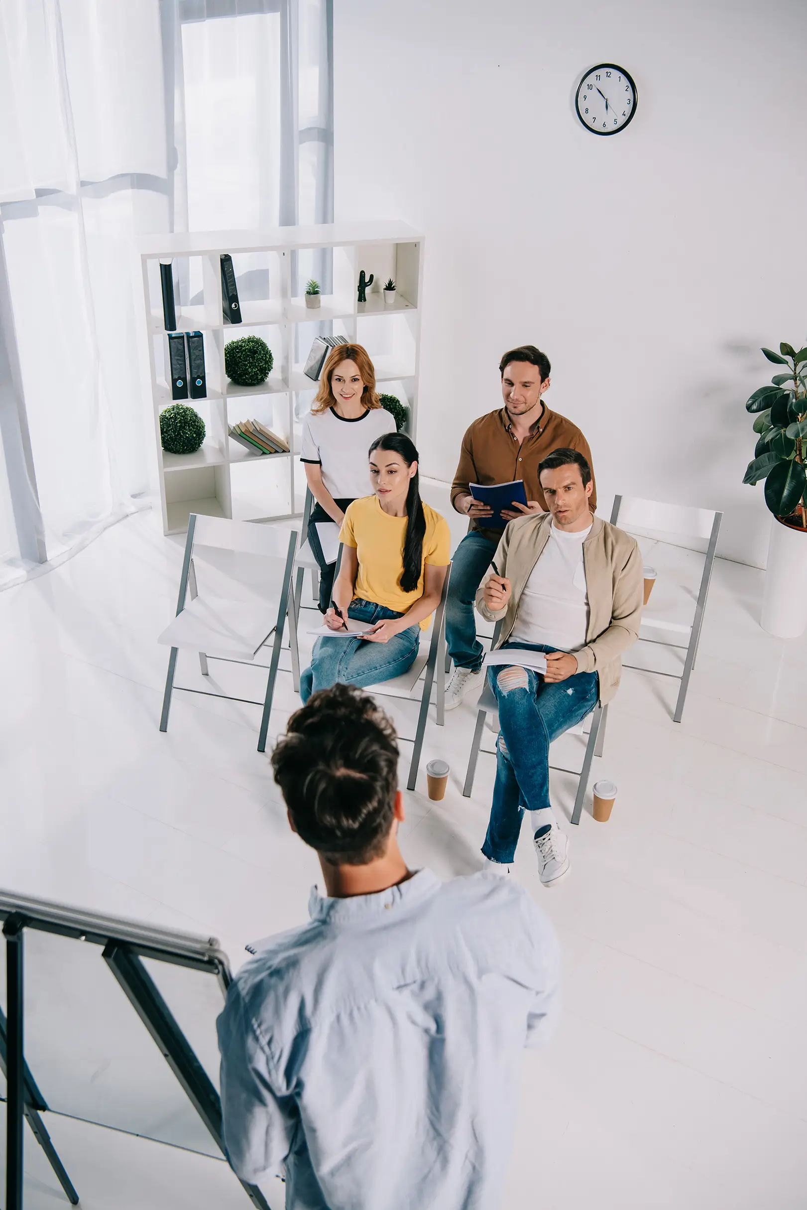 Group of people sitting in a room during a therapy session