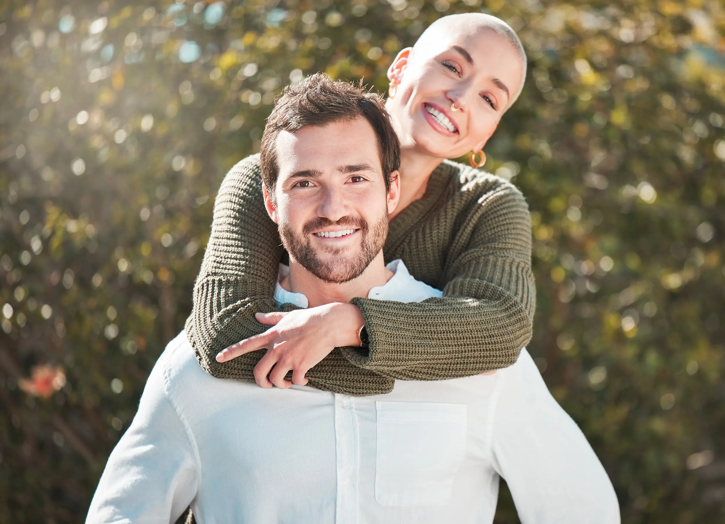 Man and woman in a relationship smiling and hugging