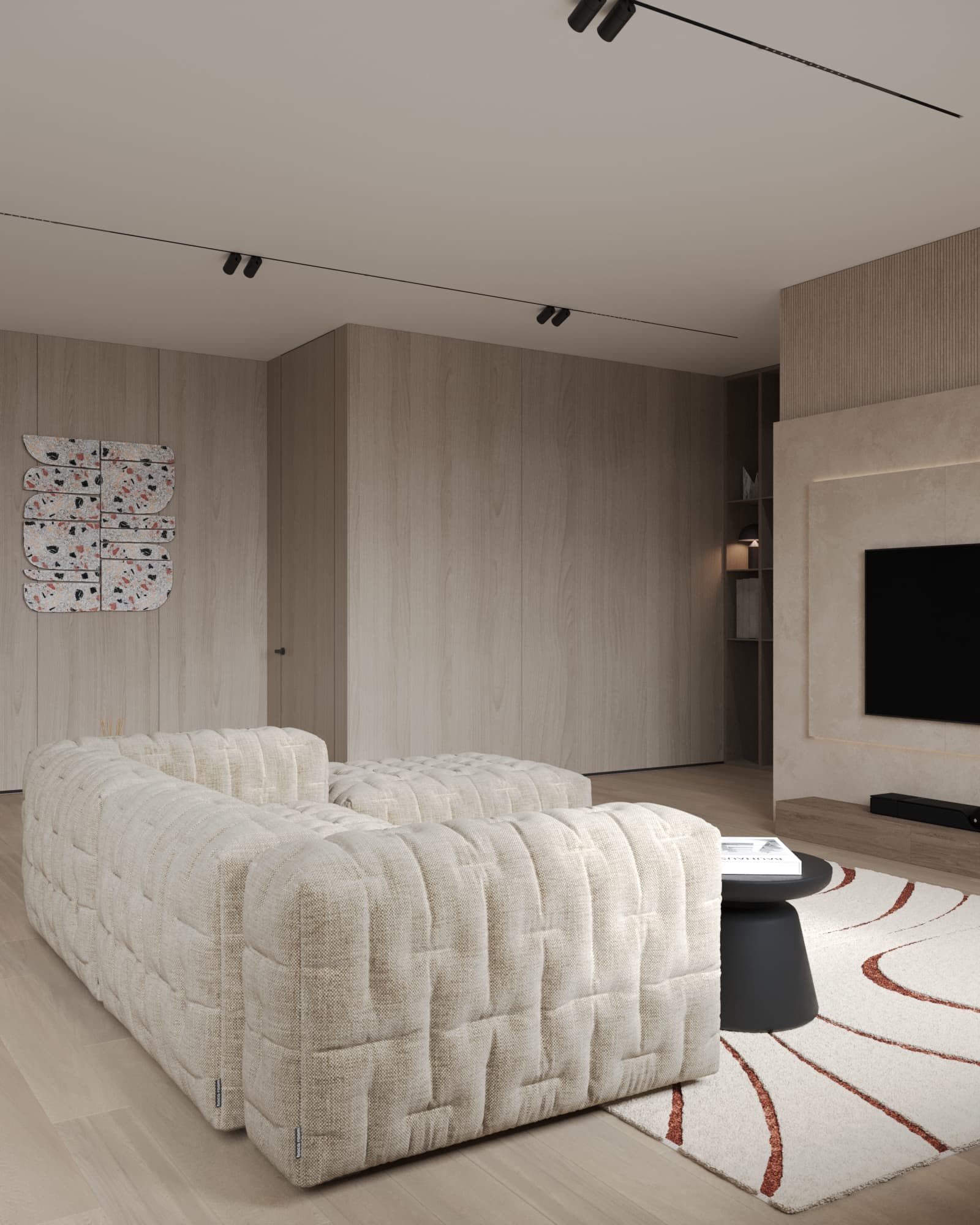 Textured beige modular sofa in front of wooden panel walls and terrazzo wall art in a cozy modern living room