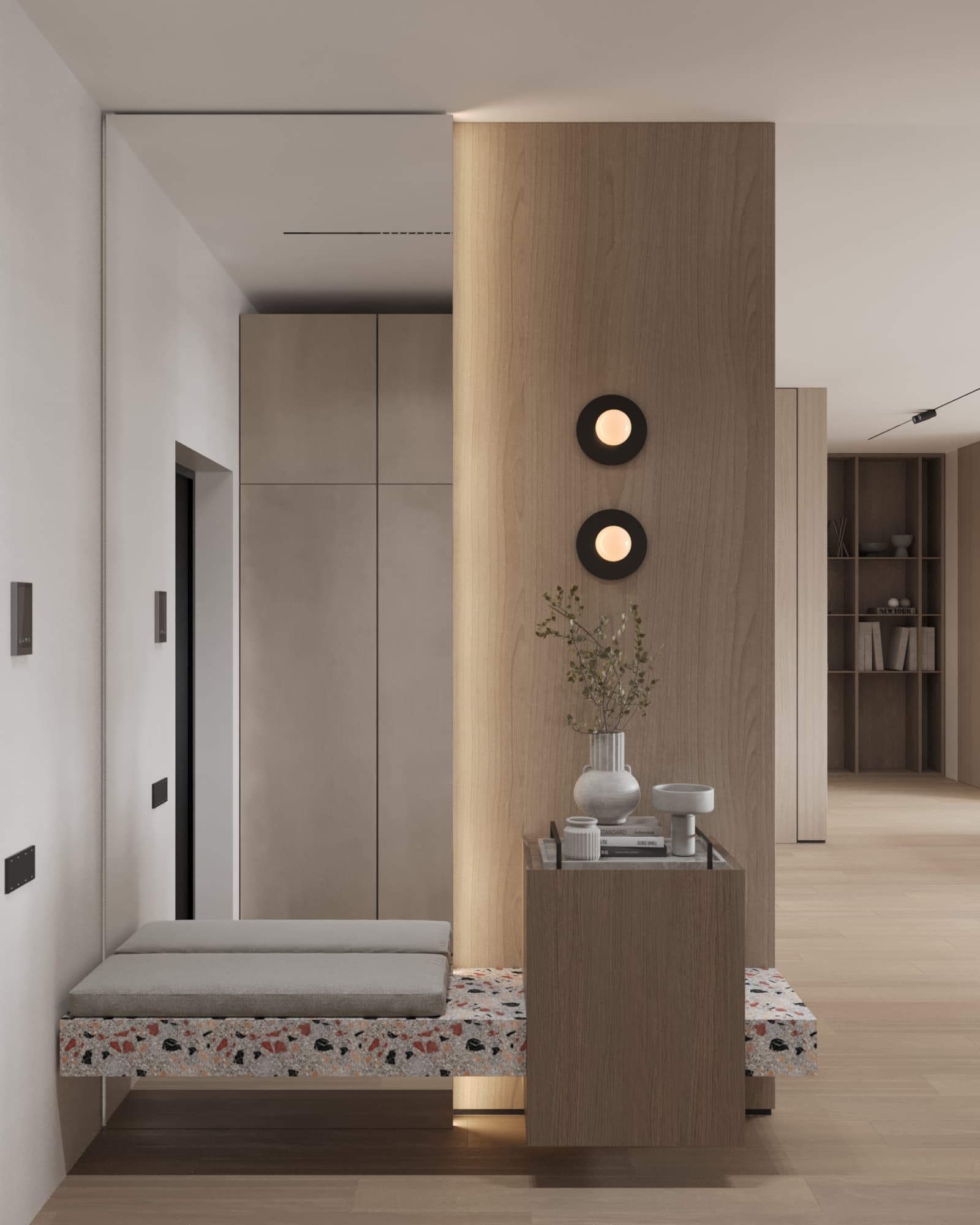 Minimalist entryway with terrazzo bench, wood-paneled wall, and soft wall-mounted lighting