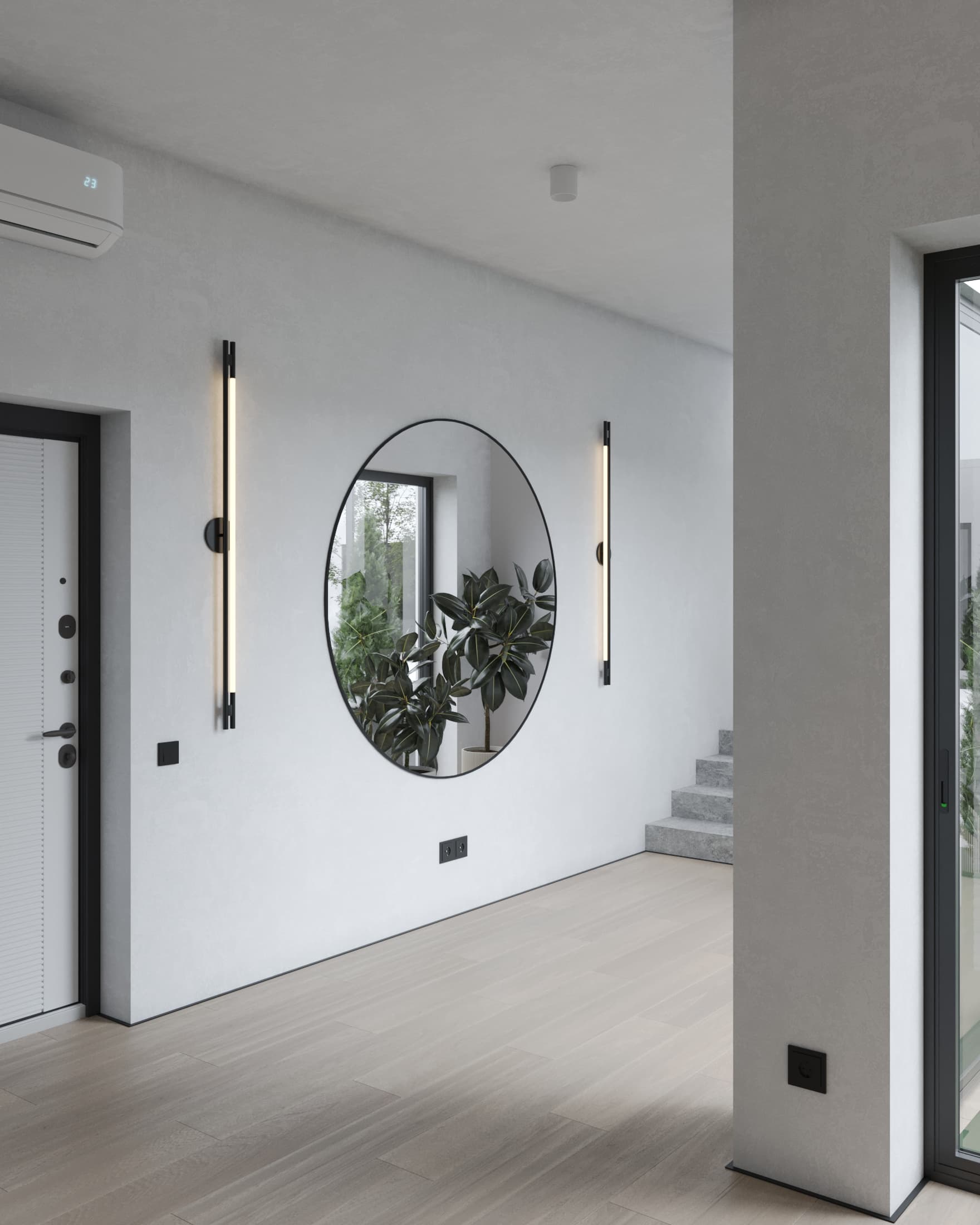 Modern entryway with round wall mirror, vertical lights, light wood flooring, and a view toward minimalist concrete stairs