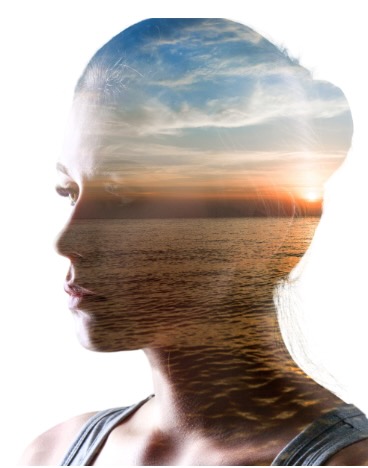 A lady in silhouette with a superimposed ocean view showing how nature invites us to engage all our senses