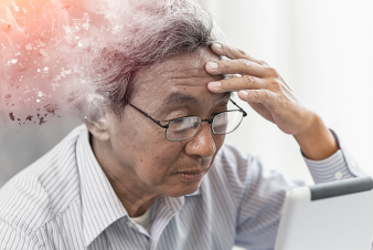 a man whose memory is fading, sitting infront of a computer 