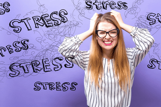 A person with glasses is holding their head in their hands, looking distressed, with the word "stress" written repeatedly around them against a purple background.