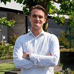 Colleague in front of the Europe Grass sign