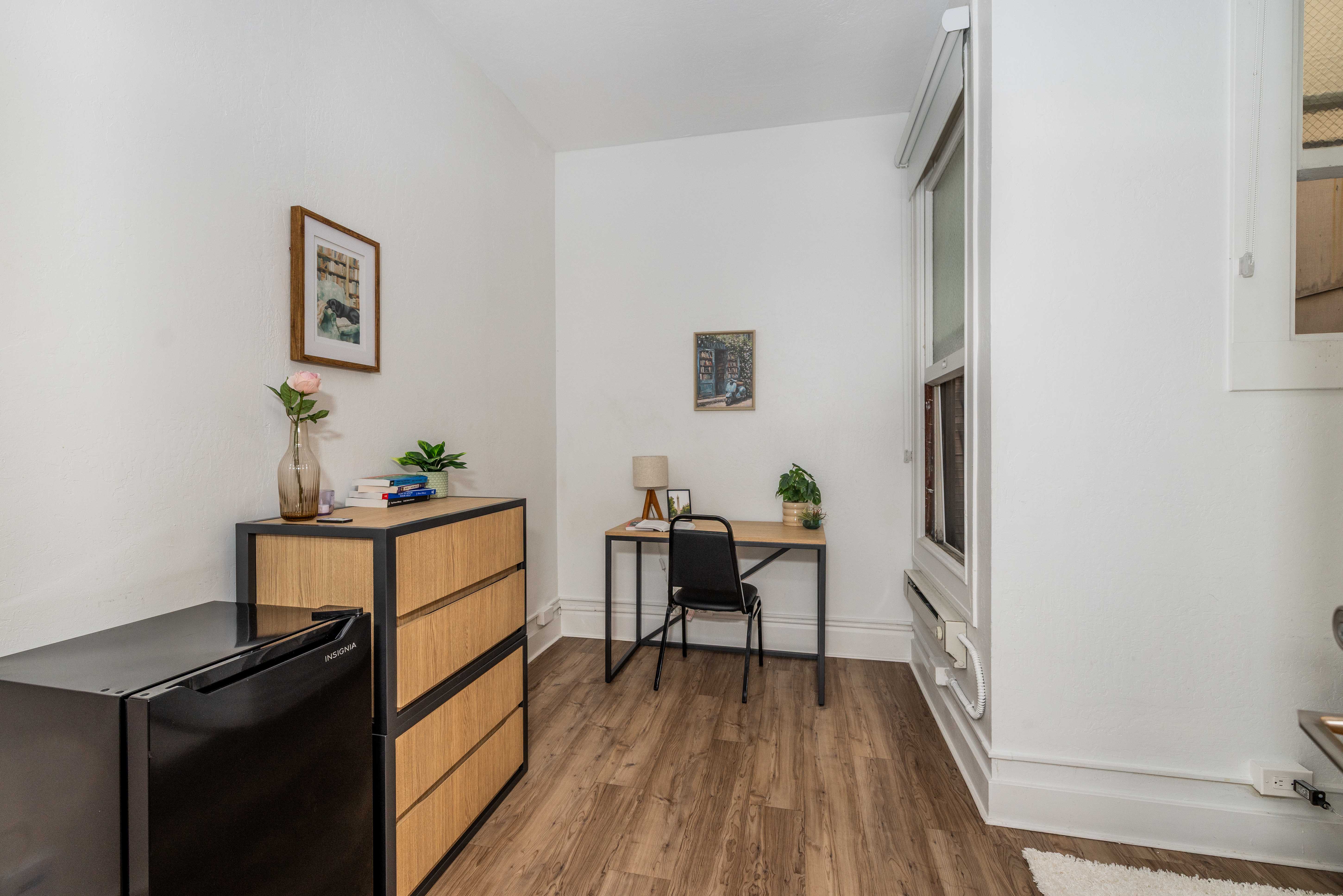 Standard room with desk and dresser