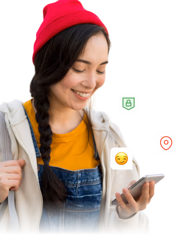 Smiling young woman wearing a red beanie, yellow shirt, and denim overalls, looking at her smartphone with digital icons of a lock, location pin, and an emoji around her.