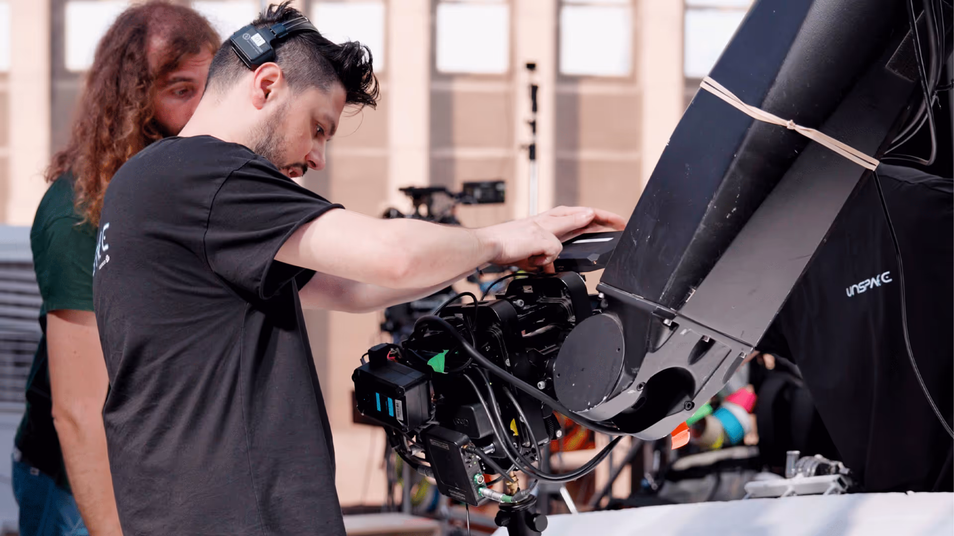 UNSPACE engineer calibrating robotic camera head and cine rig for virtual-production system rental.