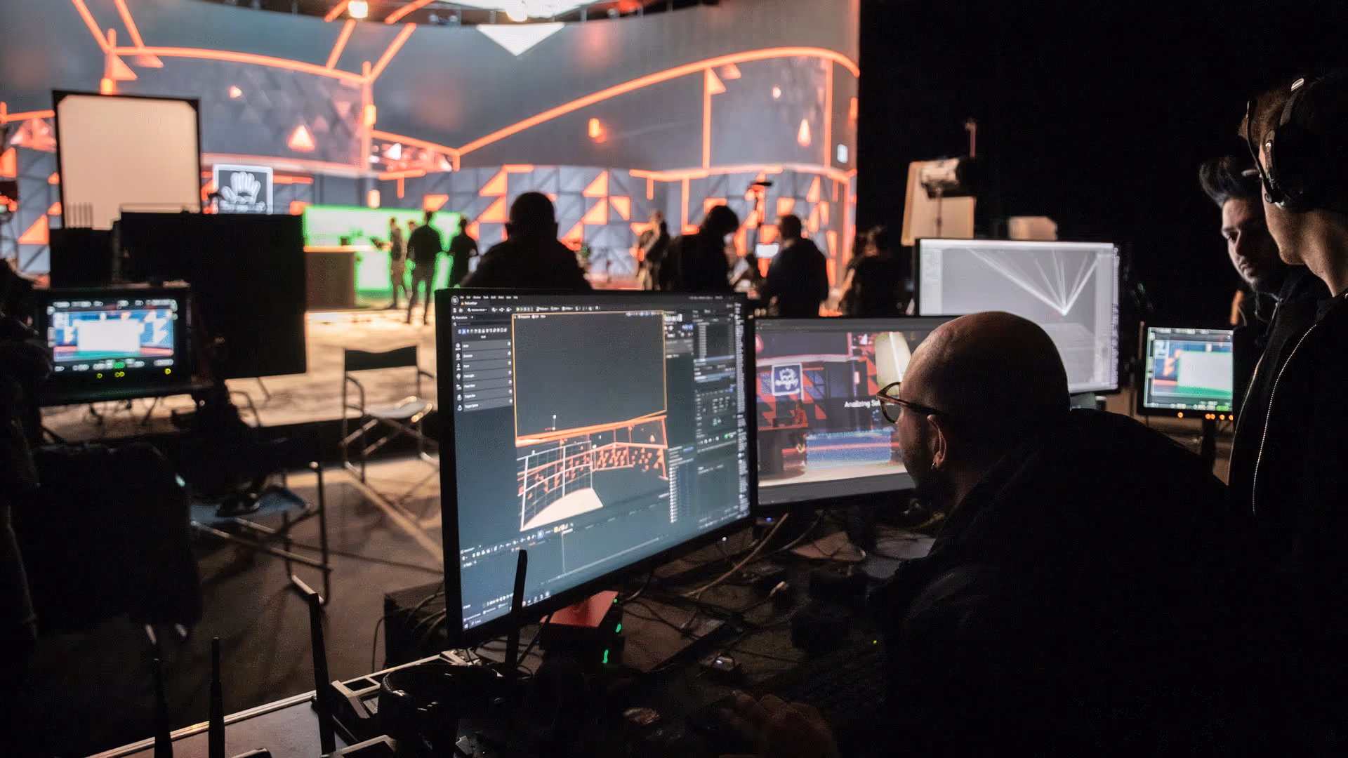 Technicians calibrate LED-floor colour on multi-monitor desk using UNSPACE Floor-Matcher plugin during live shoot.